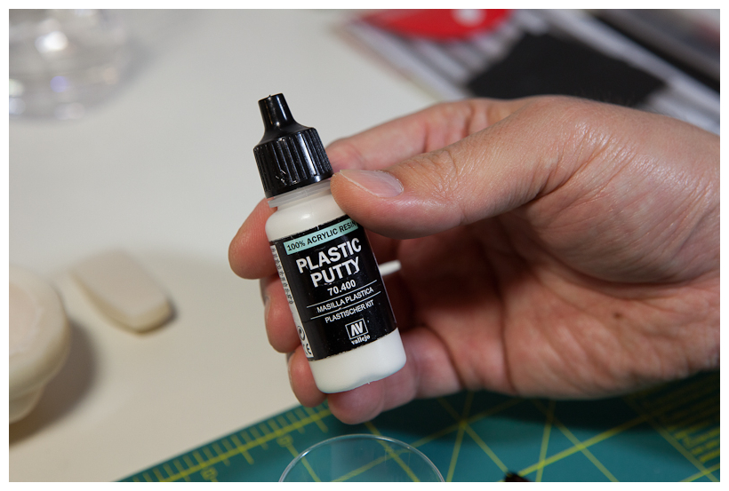 Sanding model surfaces with fine grit paper