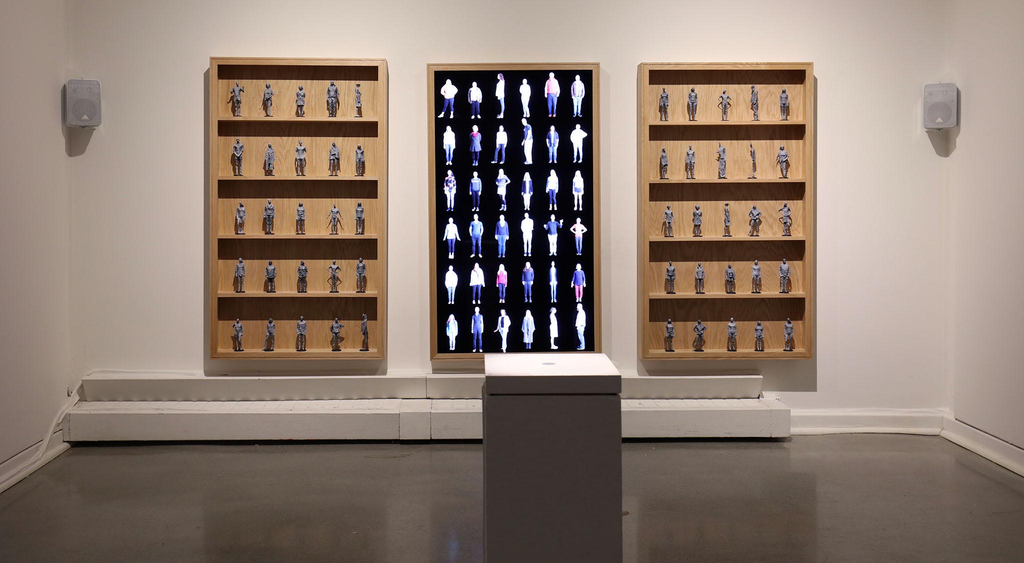 The Reminiscence installation at White Box Gallery showing display, sculptures, and podium